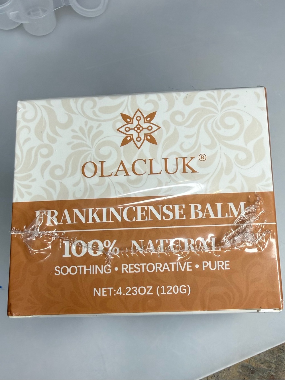 Olacluk Frankincense Balm in Beige & White Packaging
